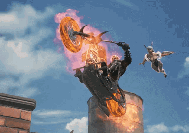 a man on a motorcycle with flames coming out of the wheel