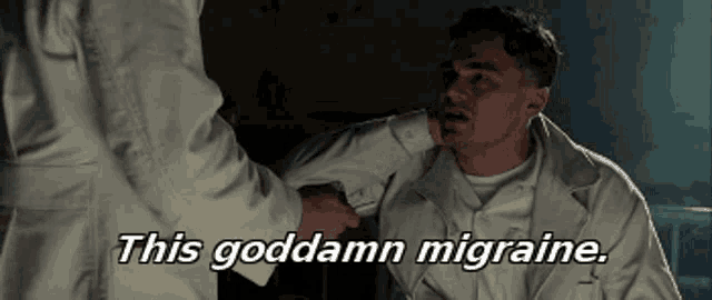 a man in a white coat is talking to another man with the words this goddamn migraine above him