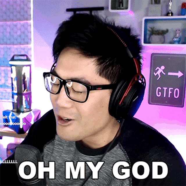 a man wearing glasses and headphones says " oh my god "