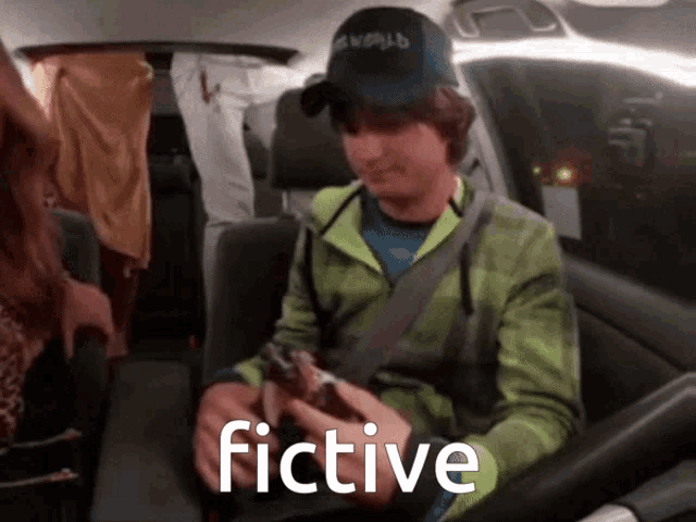 a person in a car with the word fictive written on the bottom