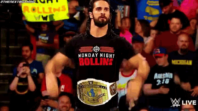 a man wearing a monday night rolling t-shirt is standing in front of a crowd