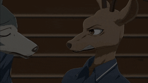 a wolf and a deer are standing next to each other