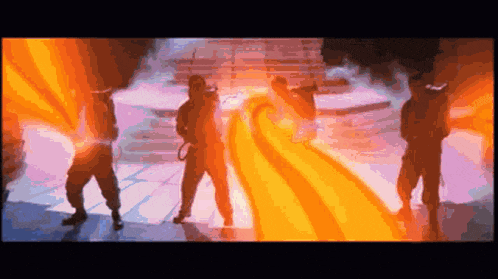 a group of people are standing in front of a flame