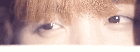 a close up of a person 's eye with a fringe