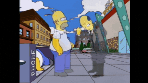 homer simpson is standing next to a phone booth