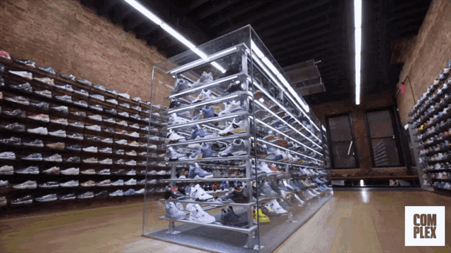 a store called com plex has lots of shoes on shelves