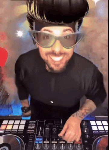 a man wearing sunglasses and a headband is playing music on a mixer
