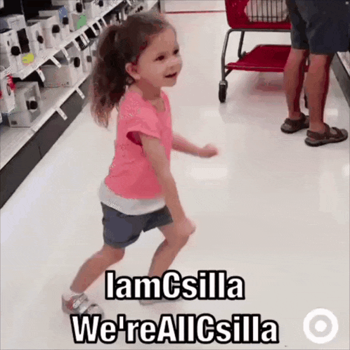 a little girl is dancing in a store with the words " iamcsilla we 're allcsilla " on the floor