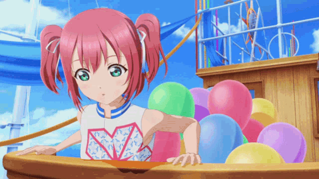 a girl with pink hair is standing in front of a pile of balloons