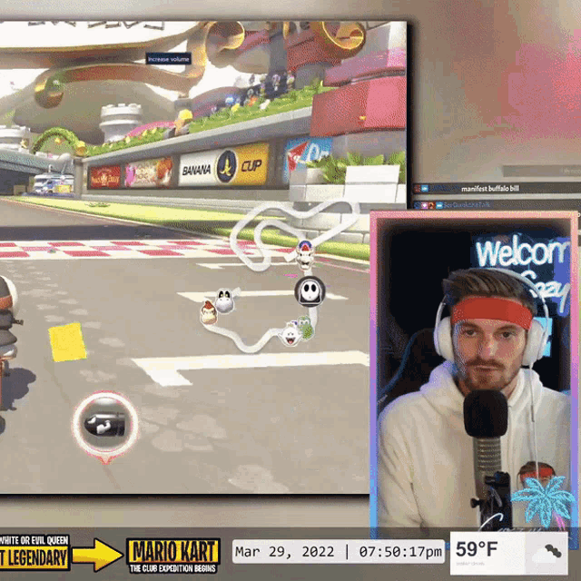 a man wearing headphones is playing mario kart