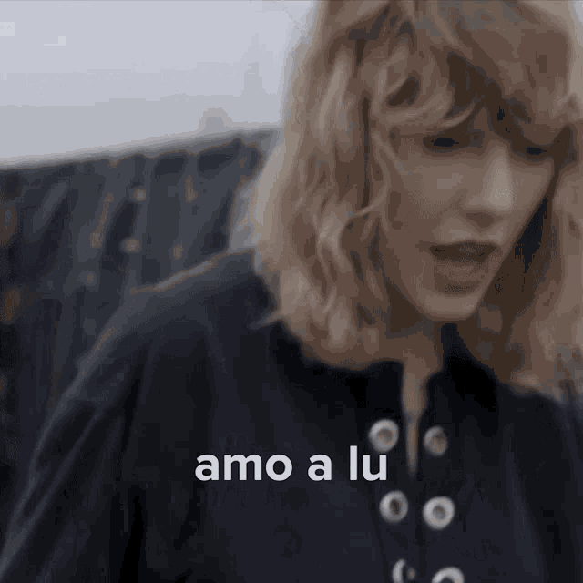a close up of a woman 's face with the words amo a lu written above her