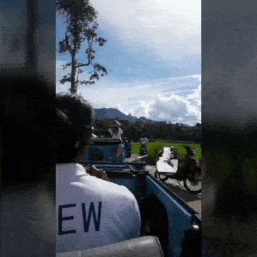 a man in a white shirt with the word ew on the back