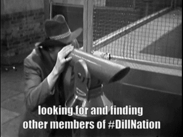 a man in a hat is looking through a binoculars with the caption looking for and finding other members of #diilnation
