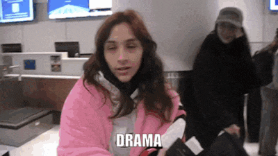 a woman in a pink jacket is holding a passport and the word drama is above her head