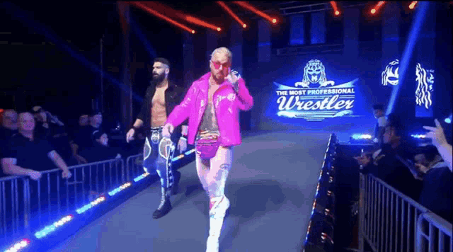 two wrestlers are walking down the aisle in front of a banner that says the most professional wrestler