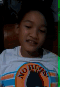 a young boy wearing a no hugs shirt