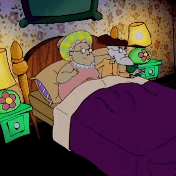 a cartoon of a man and a woman laying in a bed