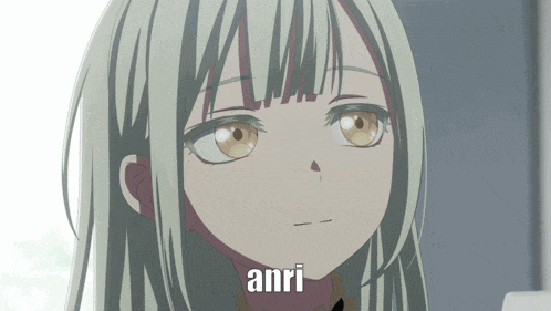 a close up of a girl with the word anri written on her face