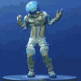 a statue of a man in a space suit is dancing on a blue surface .