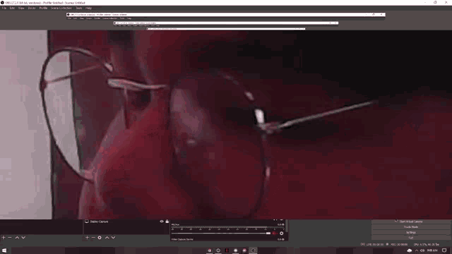 a close up of a person 's face with glasses on a computer screen .