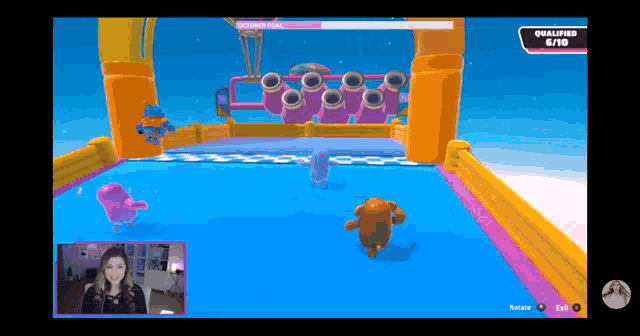 a woman is playing a video game with a score of 6/10 on the screen