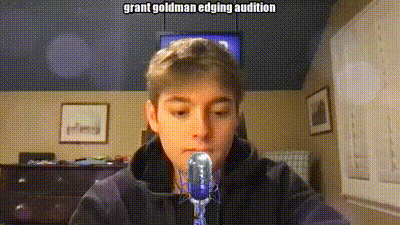 a young boy is sitting in front of a microphone with the words grant goldman edging audition written above him