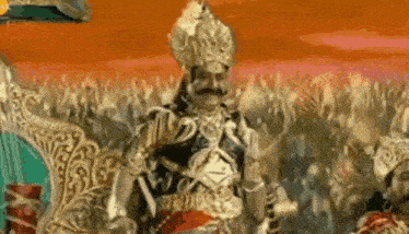 a man in a costume with a mustache is standing in front of a crowd of people .