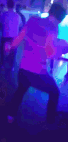 a blue light is shining on a person 's face