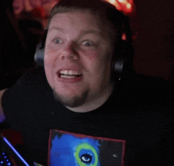 a man wearing headphones and a black shirt with a peacock on it