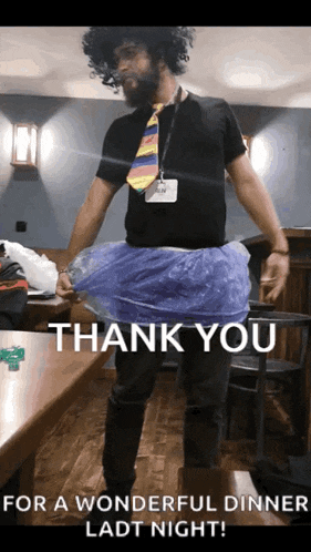 a man wearing a tie and a blue plastic skirt says thank you for a wonderful dinner last night