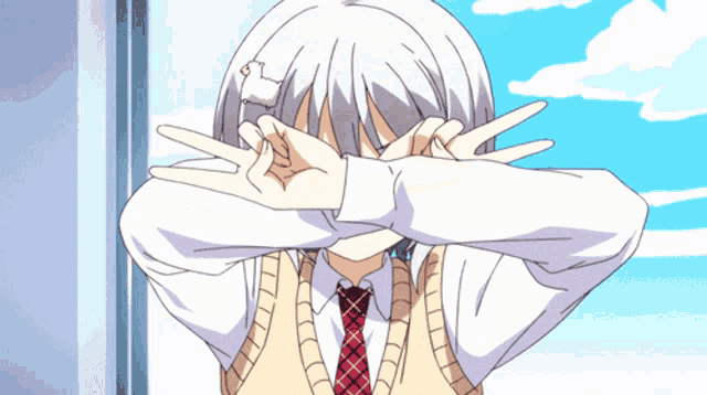 a girl with white hair and red eyes making a peace sign with her hands