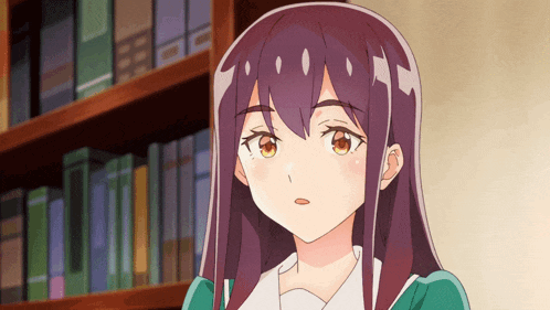 a girl with long purple hair stands in front of a book shelf