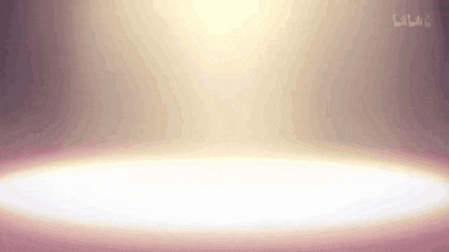 a spotlight is shining on an empty stage with a pink background .