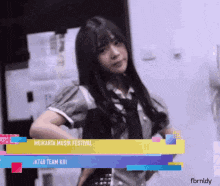 a girl in a school uniform is standing in front of a sign that says " jakarta music festival "