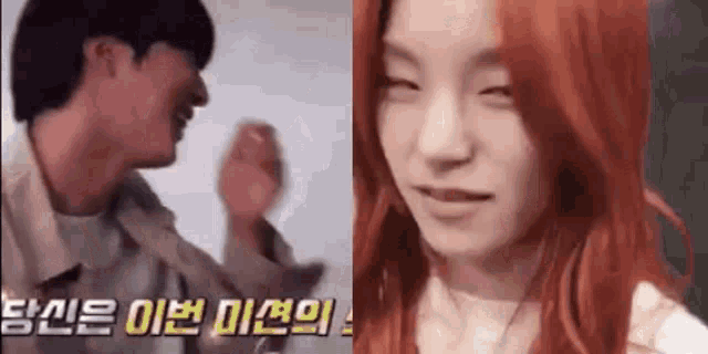 a man and a woman are standing next to each other . the woman has red hair .
