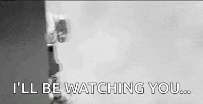 a black and white photo of a person saying `` i 'll be watching you '' .