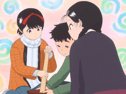 a girl is holding a wooden stick while a boy and a girl look on