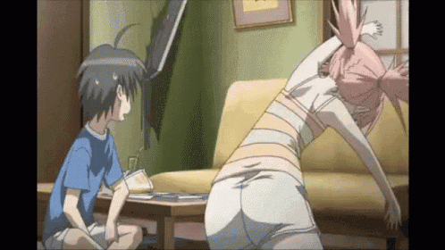 a boy and a girl are sitting on a couch in a room .