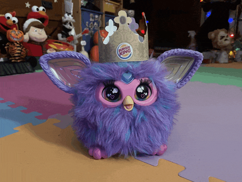 a purple toy with a burger king crown on it