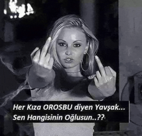 a woman in a black and white photo giving the middle finger