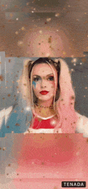 a woman in a harley quinn costume is surrounded by confetti and a tenada button