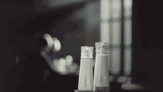a couple of bottles of lotion with the letters ecm on them