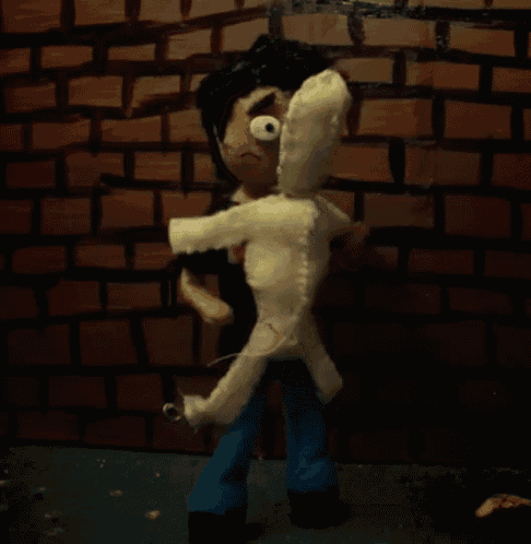 a cartoon character is standing next to a stuffed animal against a brick wall