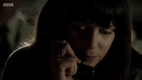 a close up of a woman talking on a phone with bbc written in the corner