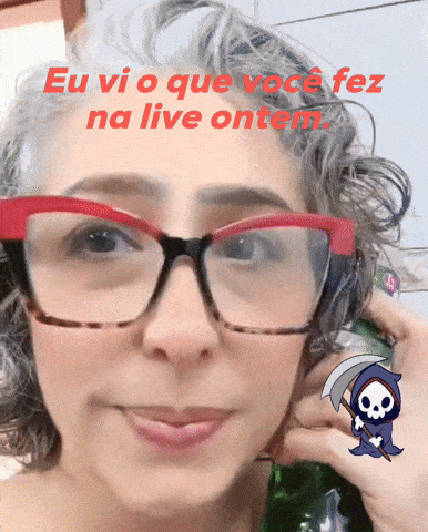 a woman wearing glasses has a grim reaper sticker on her face