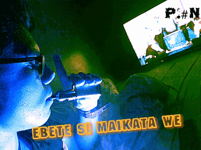 a man is holding a gun in front of a screen that says p. # n