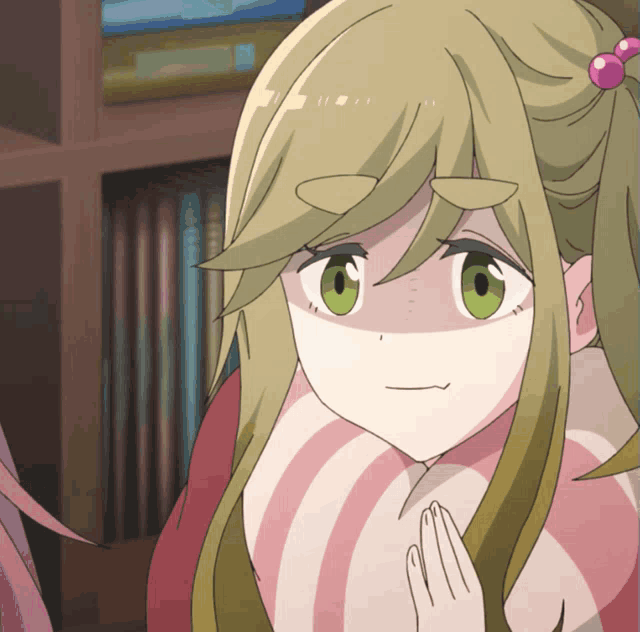 a girl with green eyes and a pink and white striped shirt