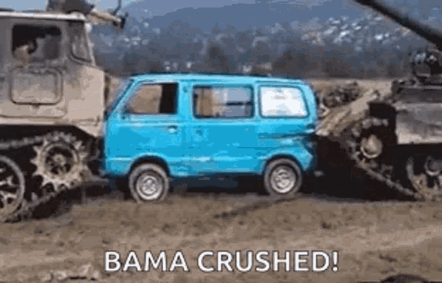 a blue van is being pulled by a tank in the mud .