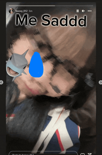 a blurry picture of a person with a shark on their face and the caption me saddd