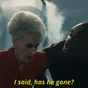 a man and a woman are standing next to each other and the woman says i said has he gone